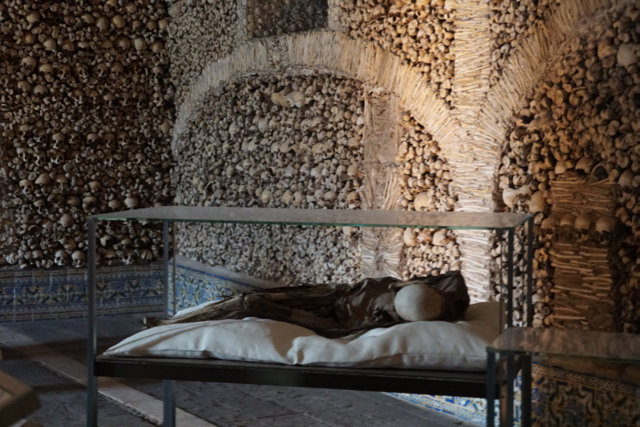 The corpse of one of the Evora chapel’s founders, surrounded by his creation, the Chapel of Bones